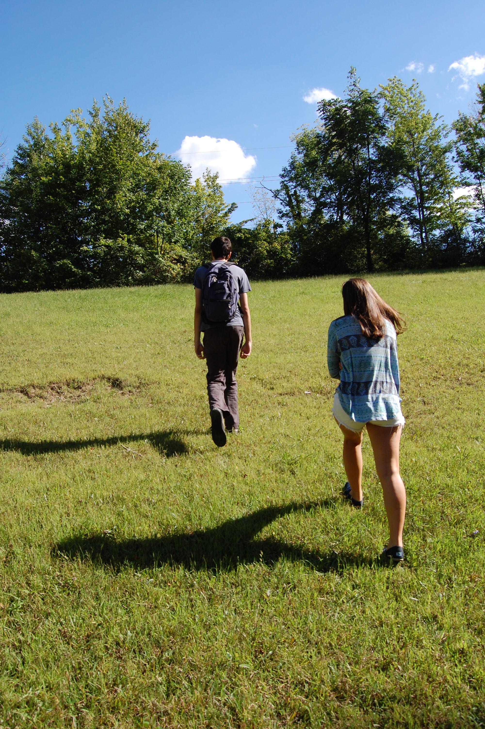 Two Students Explore the Arboretum on a Sunny Day