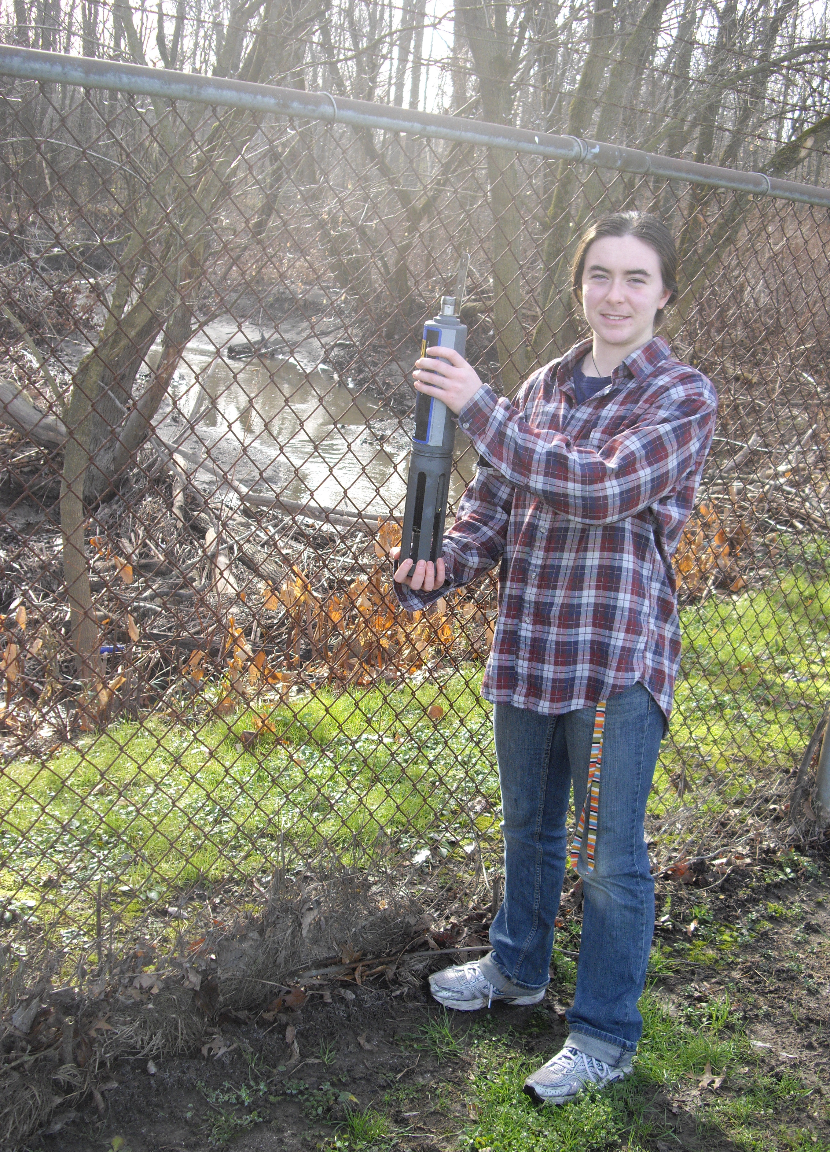 An Oberlin College student checks the monitoring equipment at the Waste Water Treatment Plant