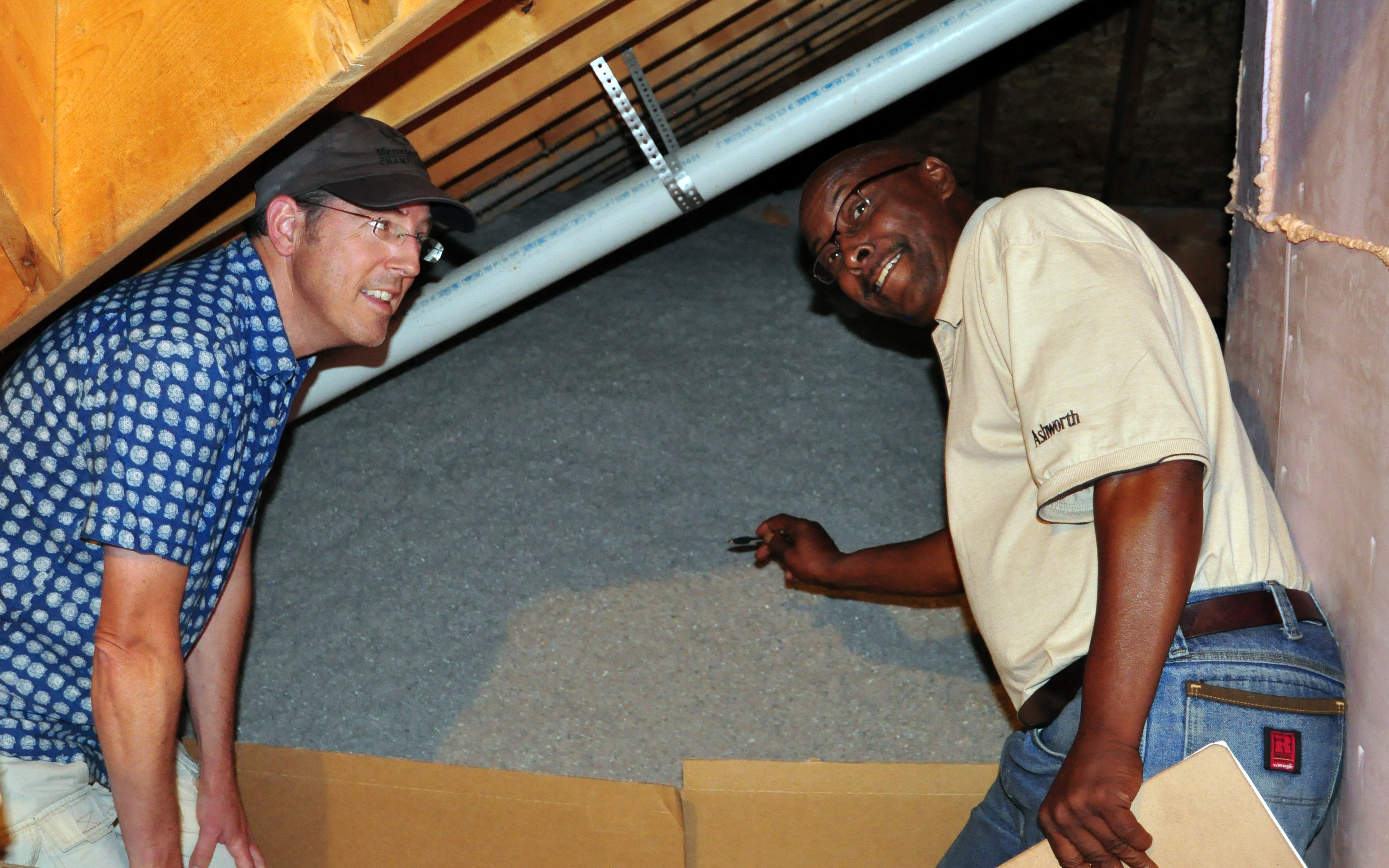 Gregory Jones conducts a home walk-through with resident Chris Hooper