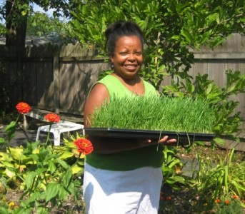 Che Gonzalez, OPL Librarian, tends to her backyard garden